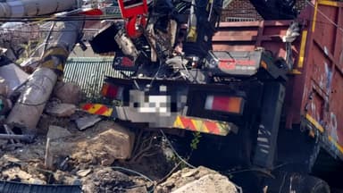 내리막길 달리던 화물차, 도로 아래 주택 덮쳐